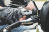 Motorcycle handlebars and leather gloves