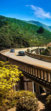 Cars driving down the highway in Big Sur, CA