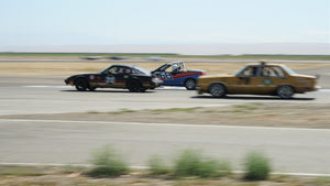 Ford Fairmont, Geo Metro, and Mazda RX7 in 24 Hours of Lemons Race