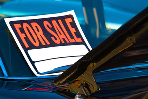 For sale sticker on a car