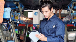 Mechanic inspects state inspection checklist