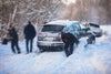 Car stuck on snow covered street