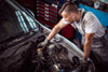 Mechanic checks brake fluid