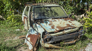 rusty car falling apart