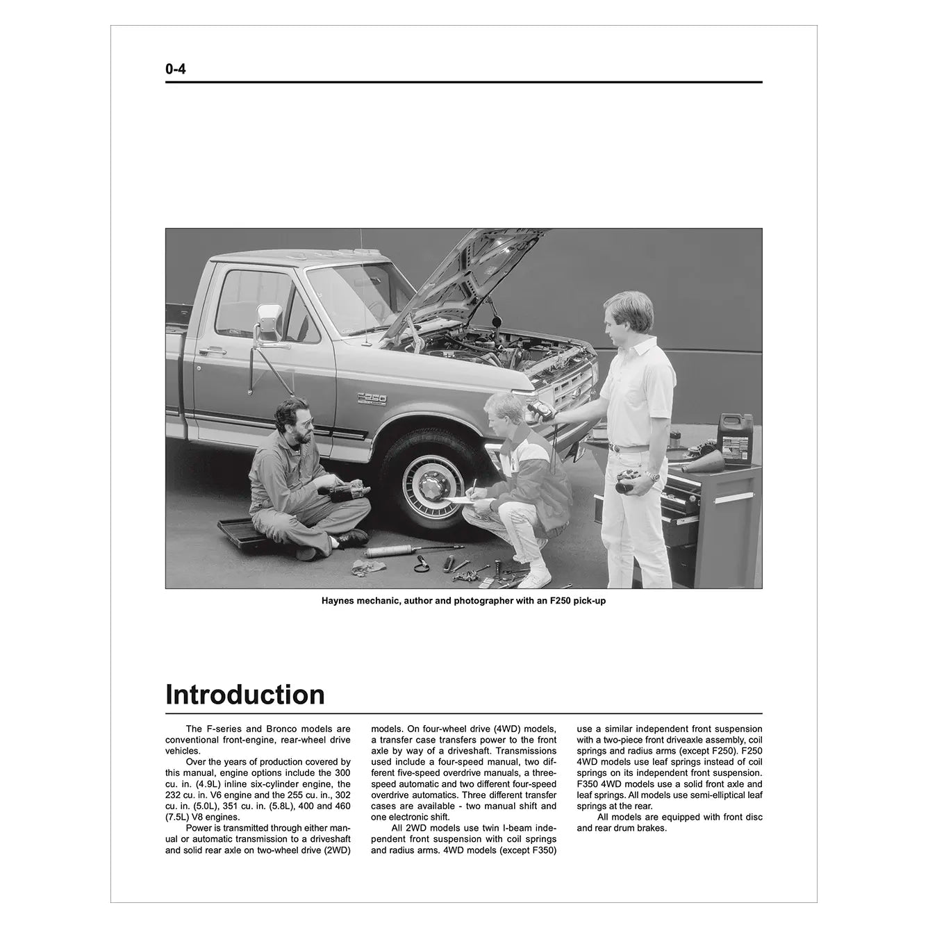 Black and white photo of three people working on a truck with an open hood.