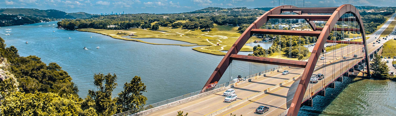 Lots of cars driving across a bridge in Austin, Texas